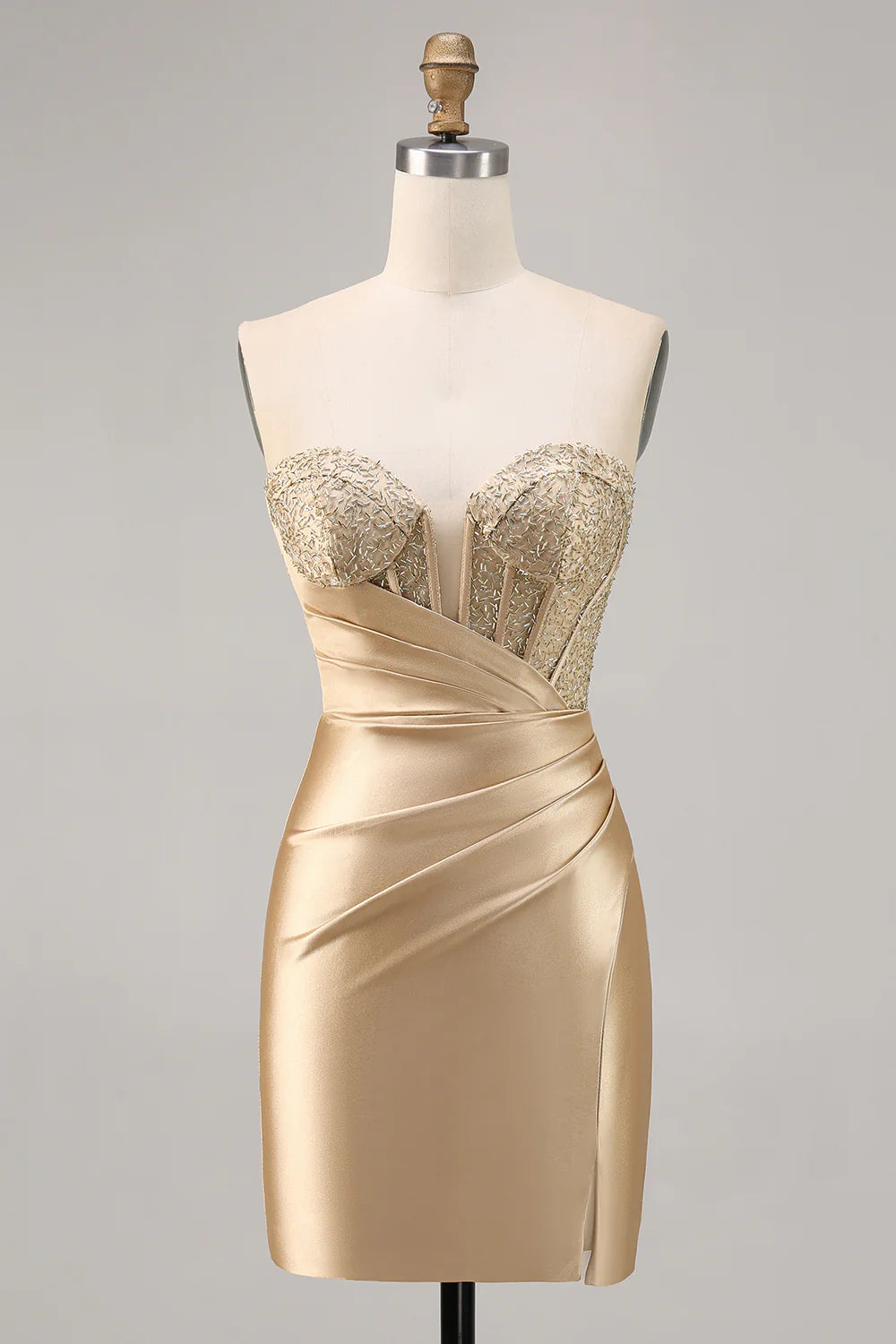 Model wearing a golden strapless bodycon satin homecoming dress.