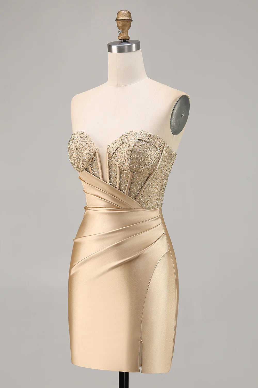 Side profile of a model showcasing a golden corset satin dress.