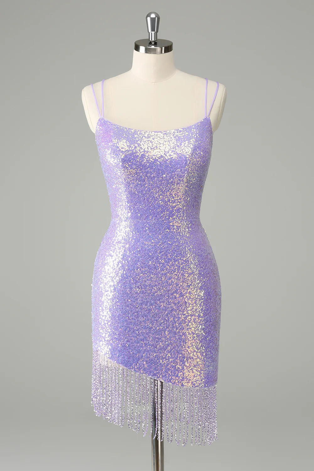 Model wearing a lilac bodycon short homecoming dress with corset, sequins, and tassels.