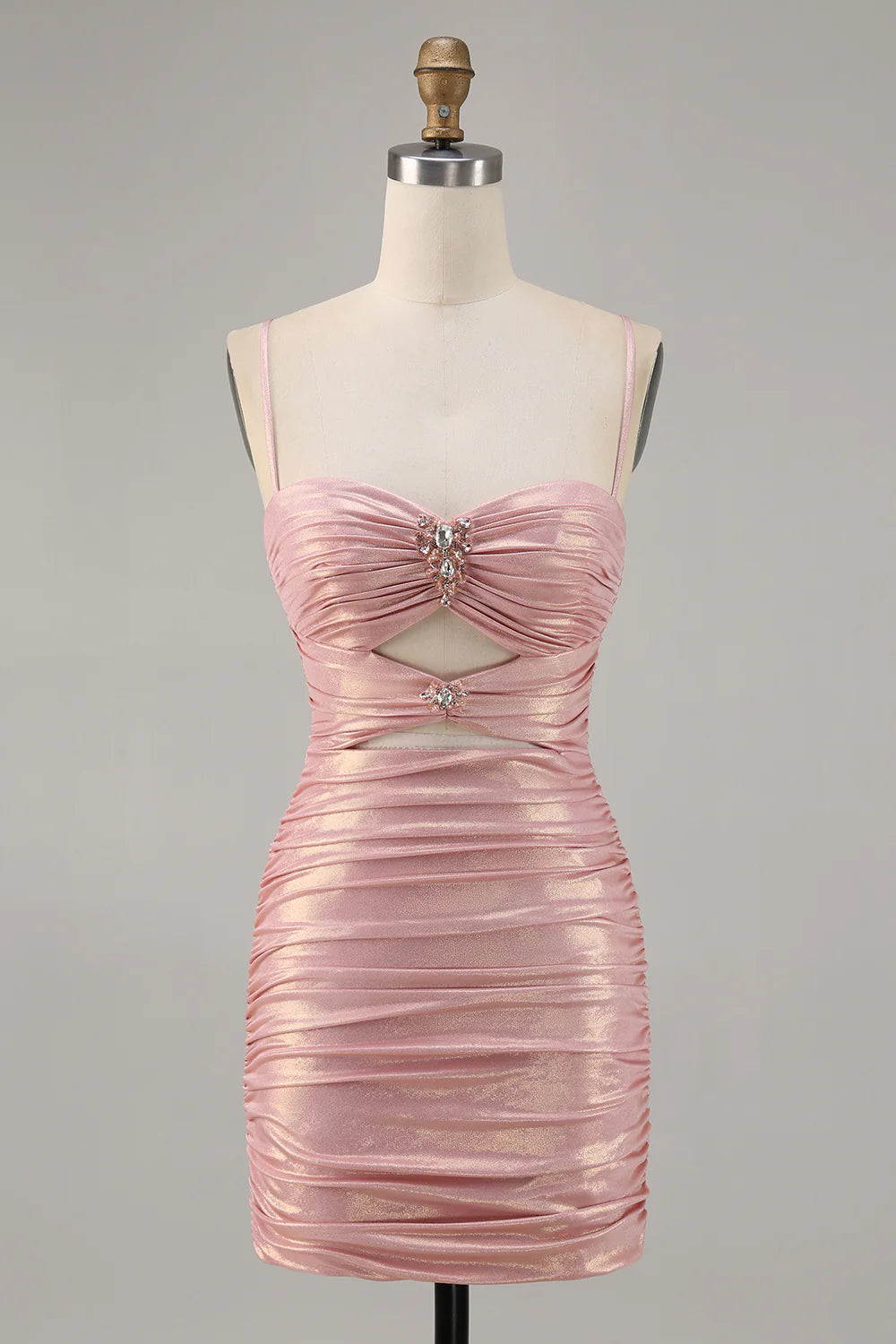 Blush bodycon strapless homecoming dress with cut-out and ruched details.