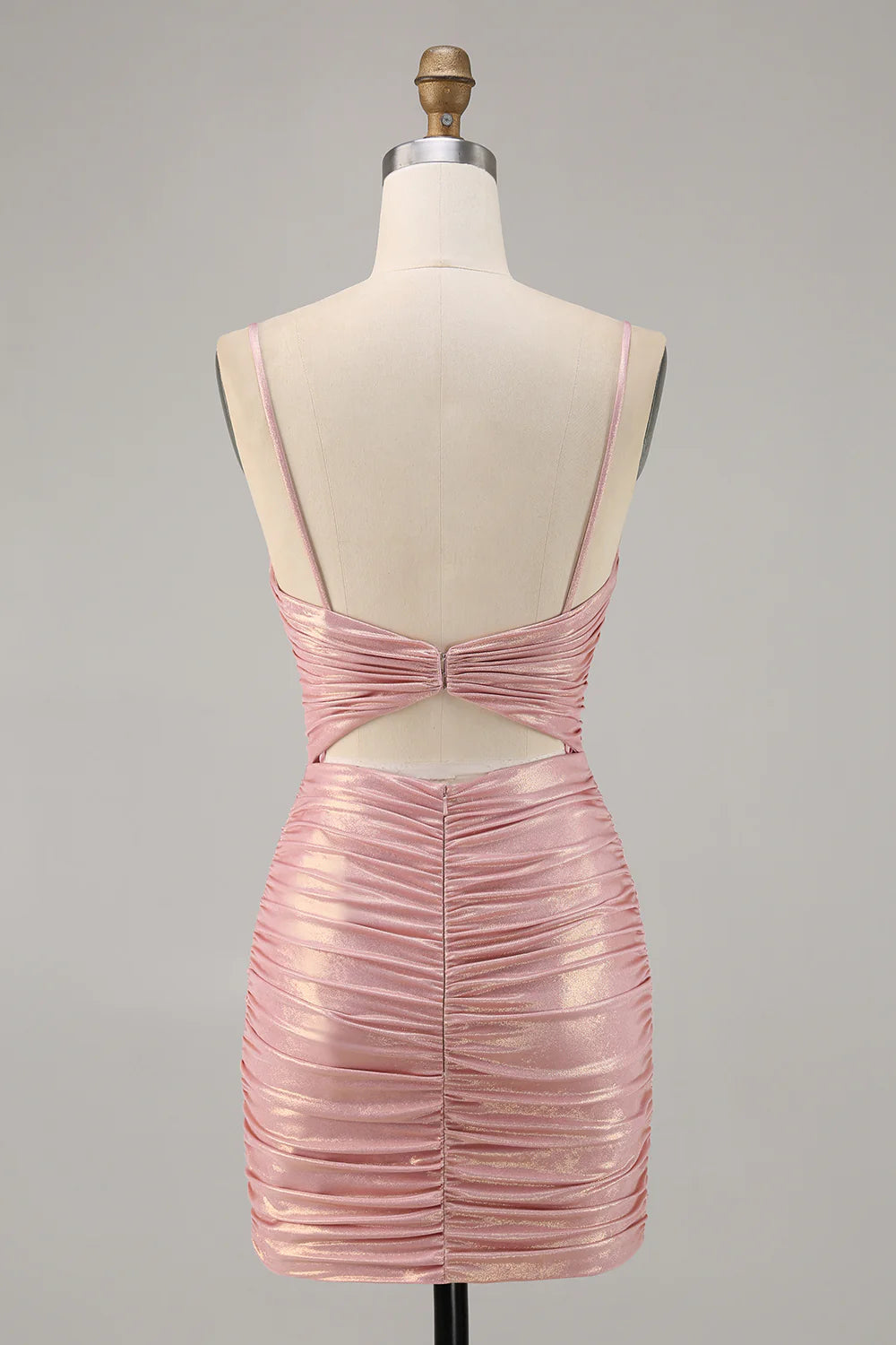 Side view of a woman wearing the blush beaded strapless bodycon dress.