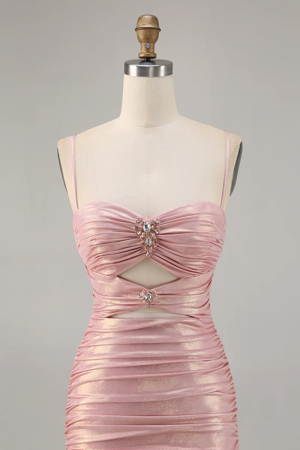 Close-up of the intricate beading and cut-out on the blush homecoming dress.