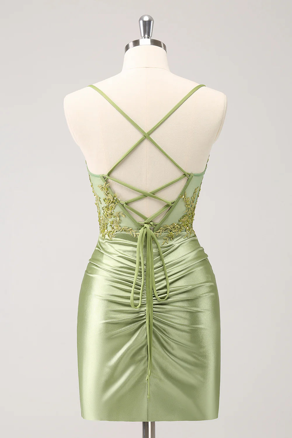 Back view of the army green bodycon dress showing lace-up corset detailing.