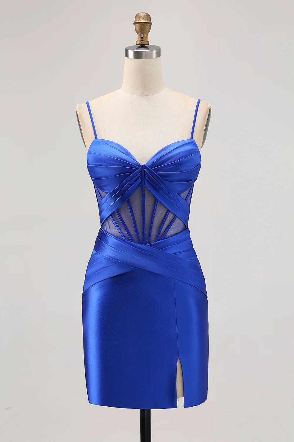Model wearing a royal blue bodycon strapless dress with sheer corset and slit.