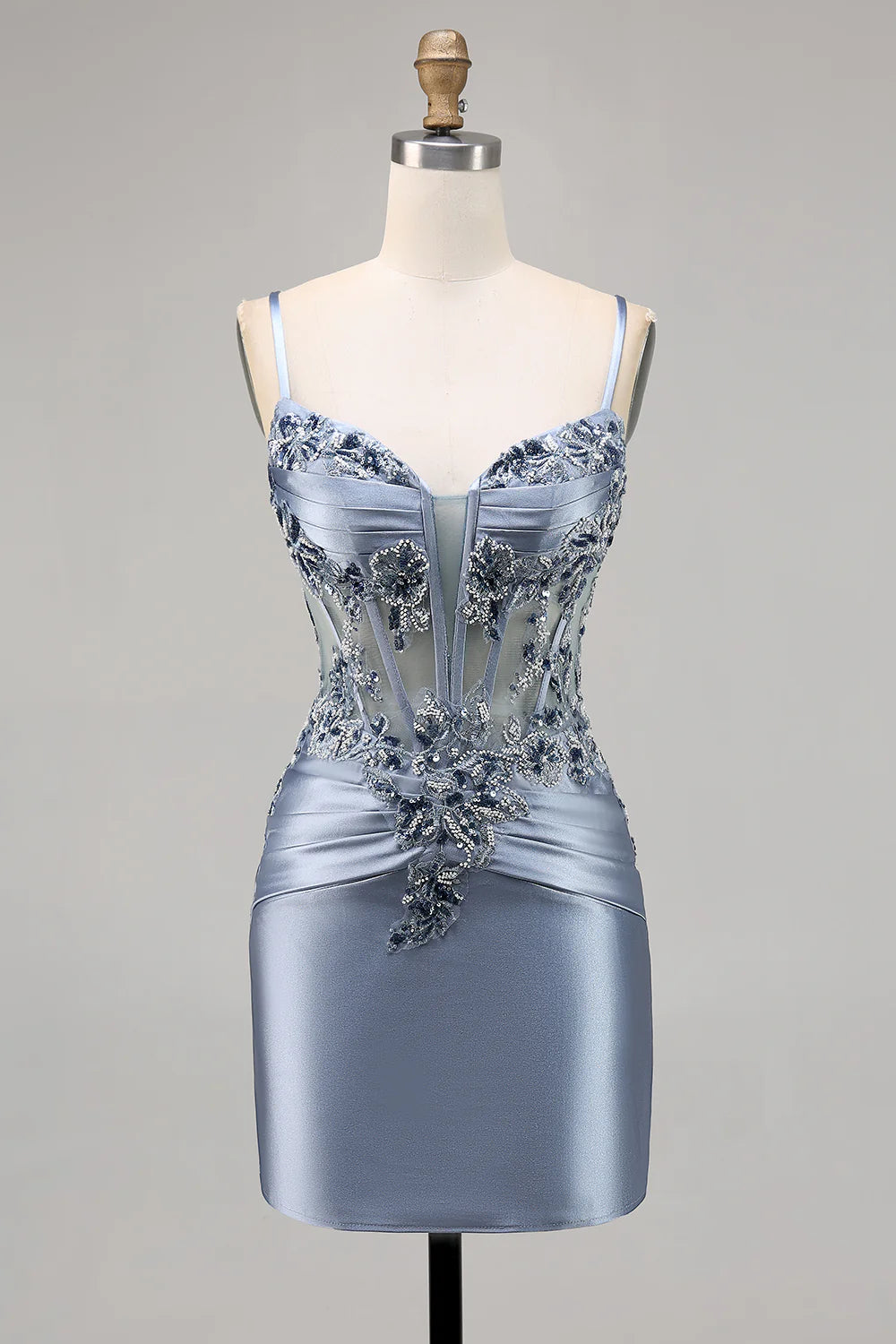 Model wearing a grey blue bodycon satin corset short homecoming dress with intricate beading.
