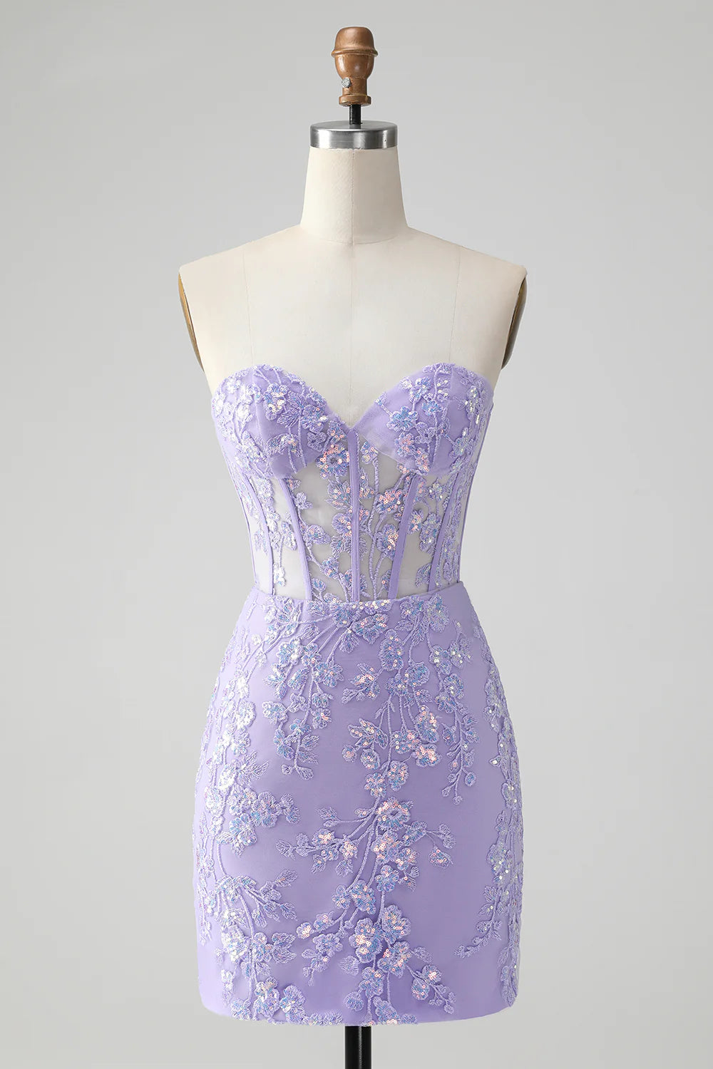 Model wearing a lilac bodycon sweetheart corset short homecoming dress with sequins.