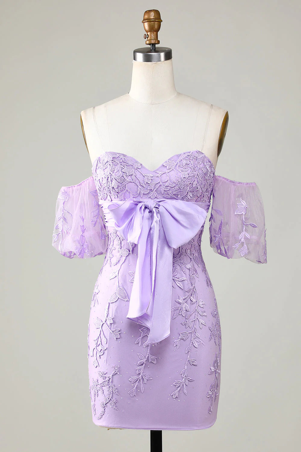 Purple bodycon homecoming dress with sweetheart neckline and bowknot detail, front view.
