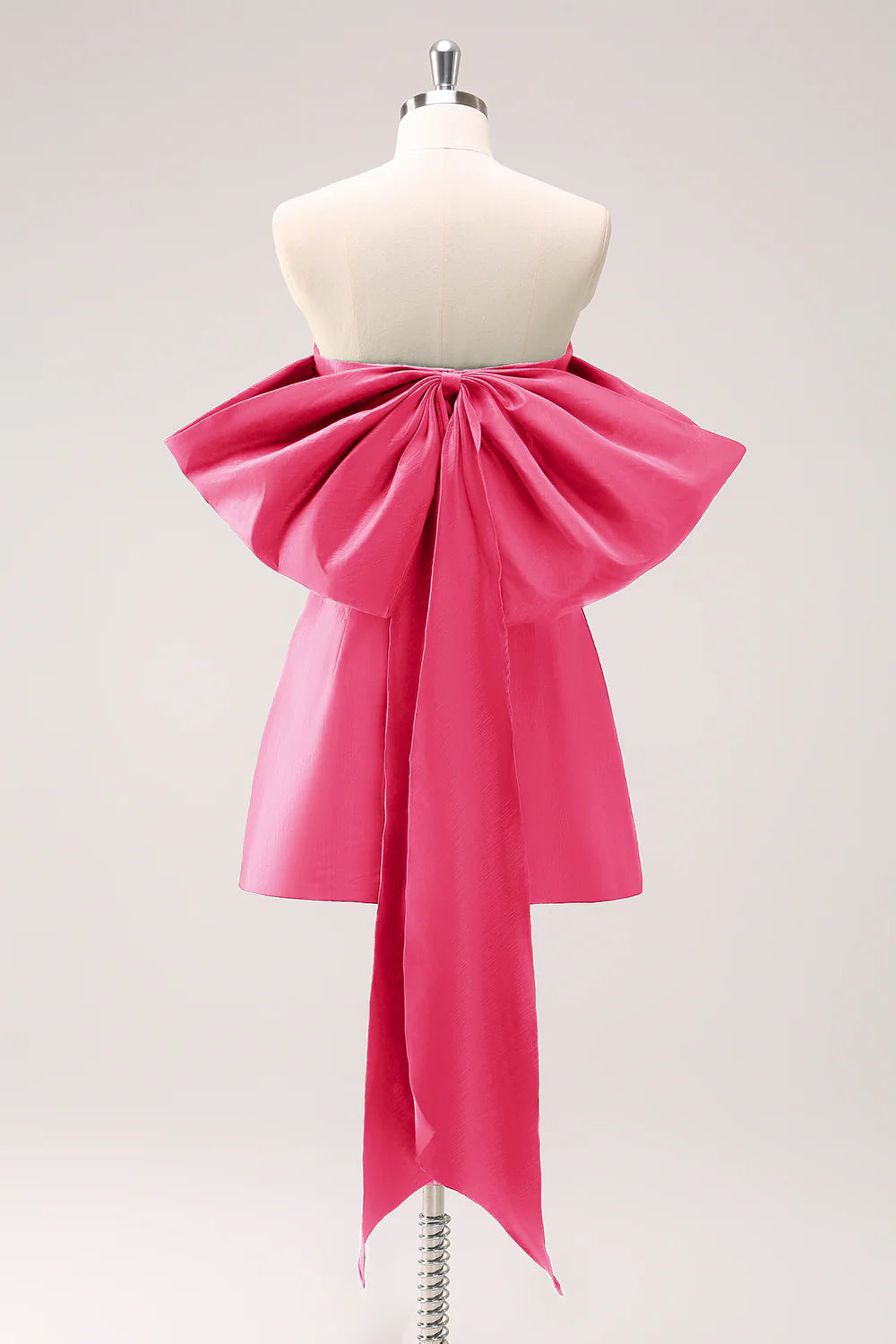 Model in a fuschia strapless A-line homecoming dress.