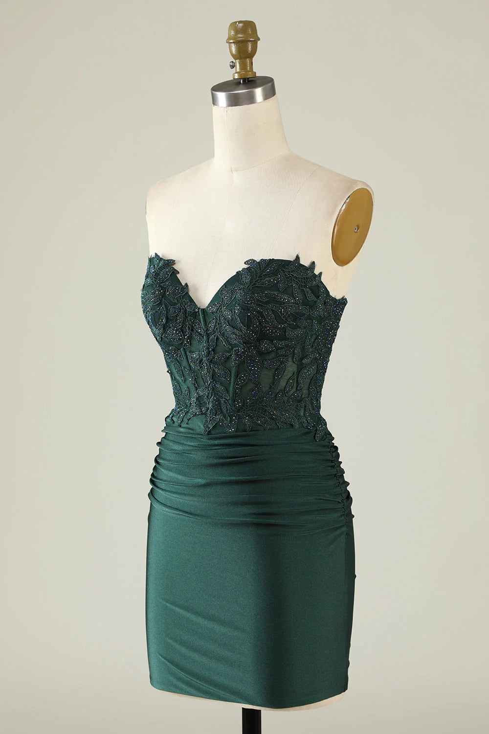 Side view of dark green short homecoming dress with elegant applique.