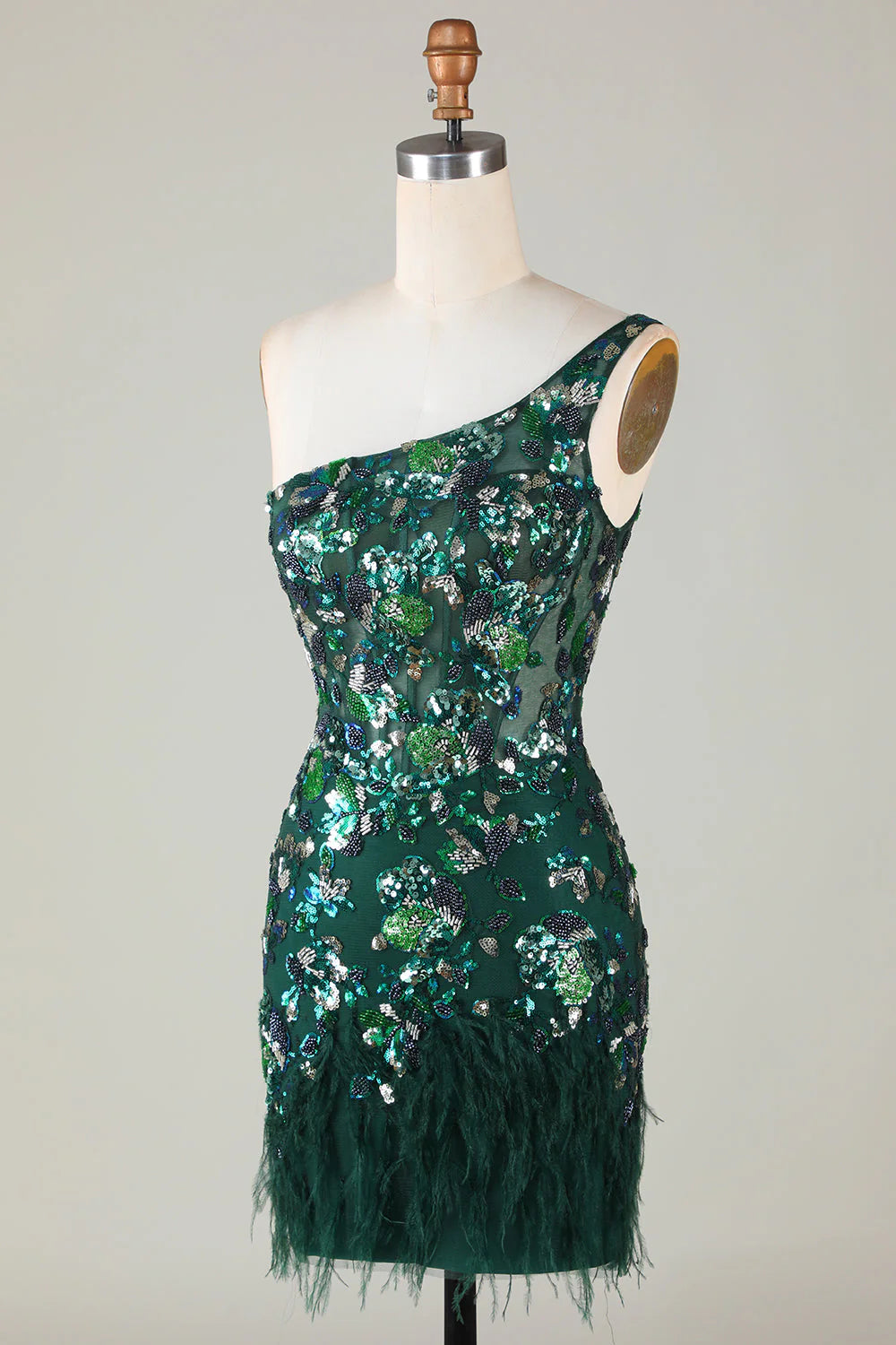 Back view of the dark green short sequin dress with a subtle feather accent.