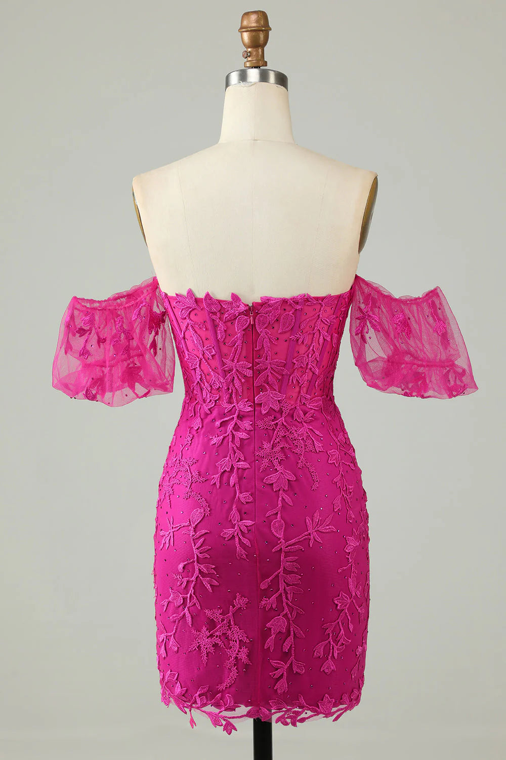 Back view of fuchsia short homecoming dress showing fitted silhouette.