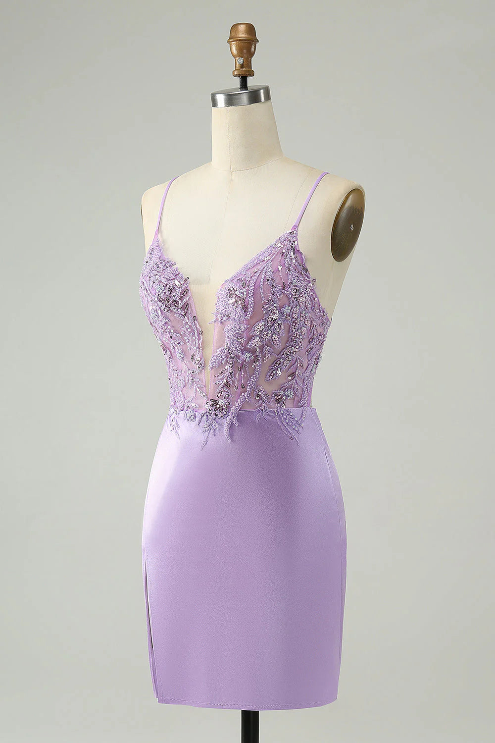 Close-up of the sequined appliques on the glitter purple dress.