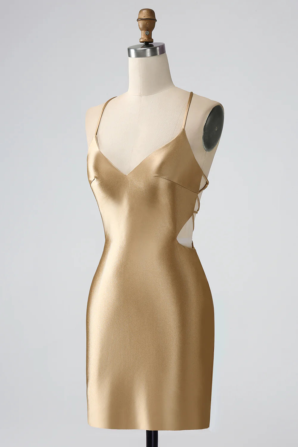 Side profile of the short golden bodycon dress.