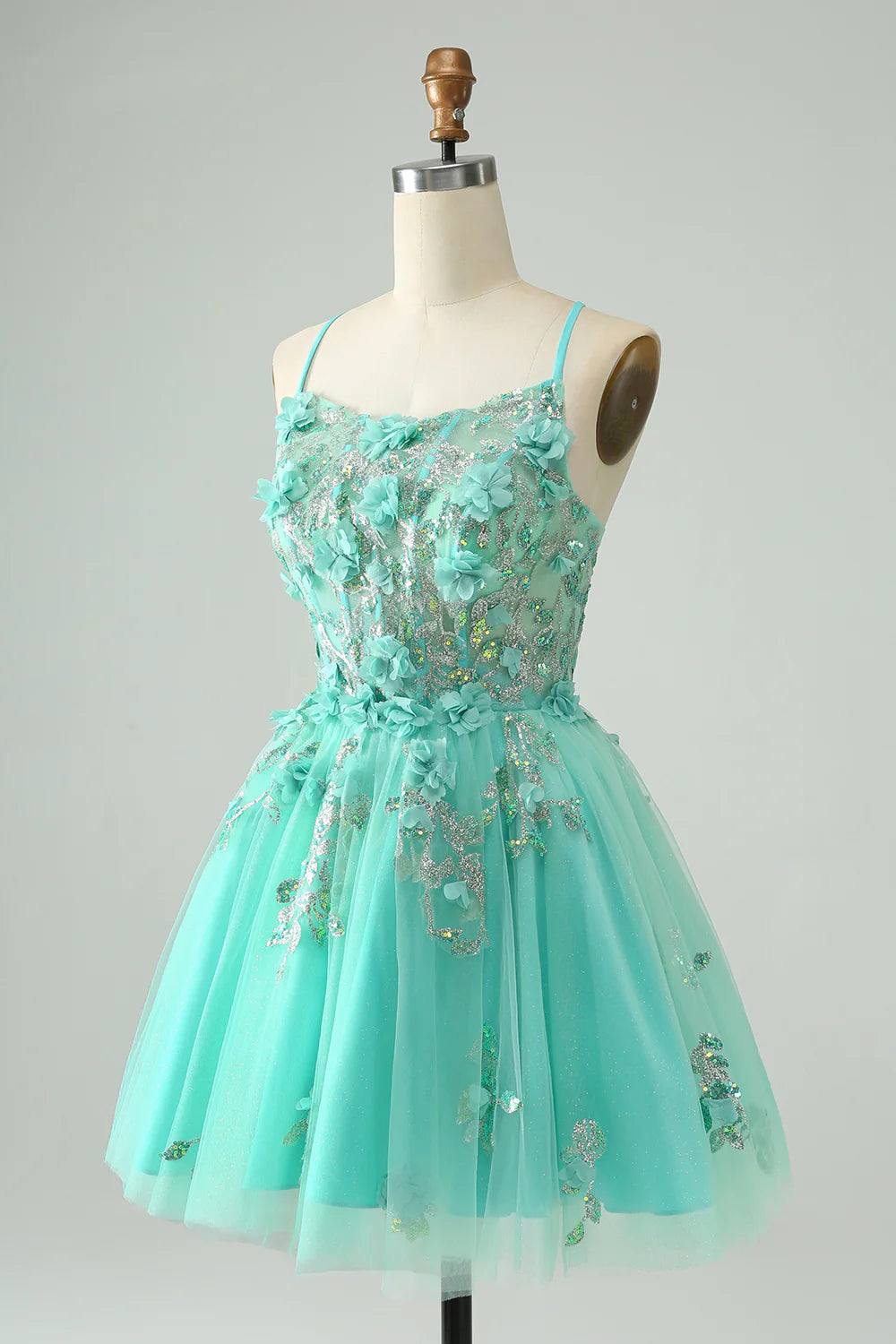 Back view of the green A-line short homecoming dress, highlighting the corset detailing.