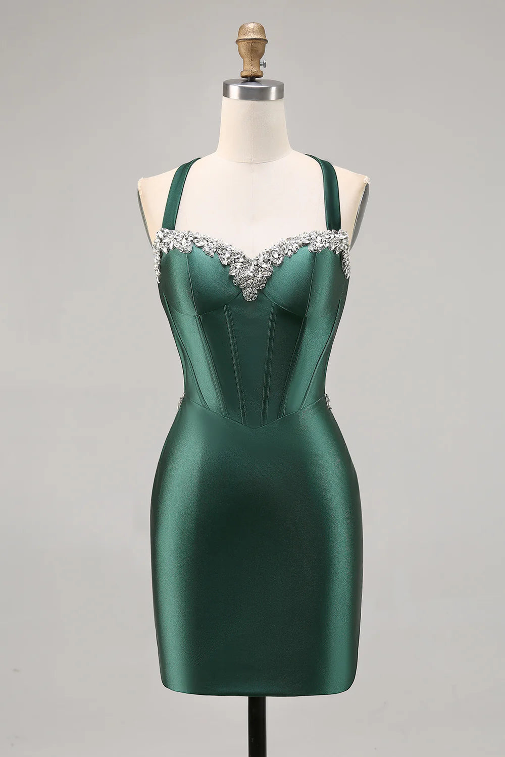 Front view of a model wearing a dark green halter bodycon satin homecoming dress.