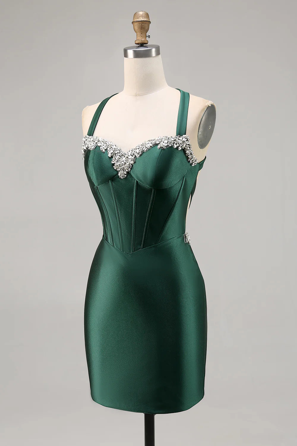 Back view of a dark green halter bodycon satin dress with corset and backless detail.