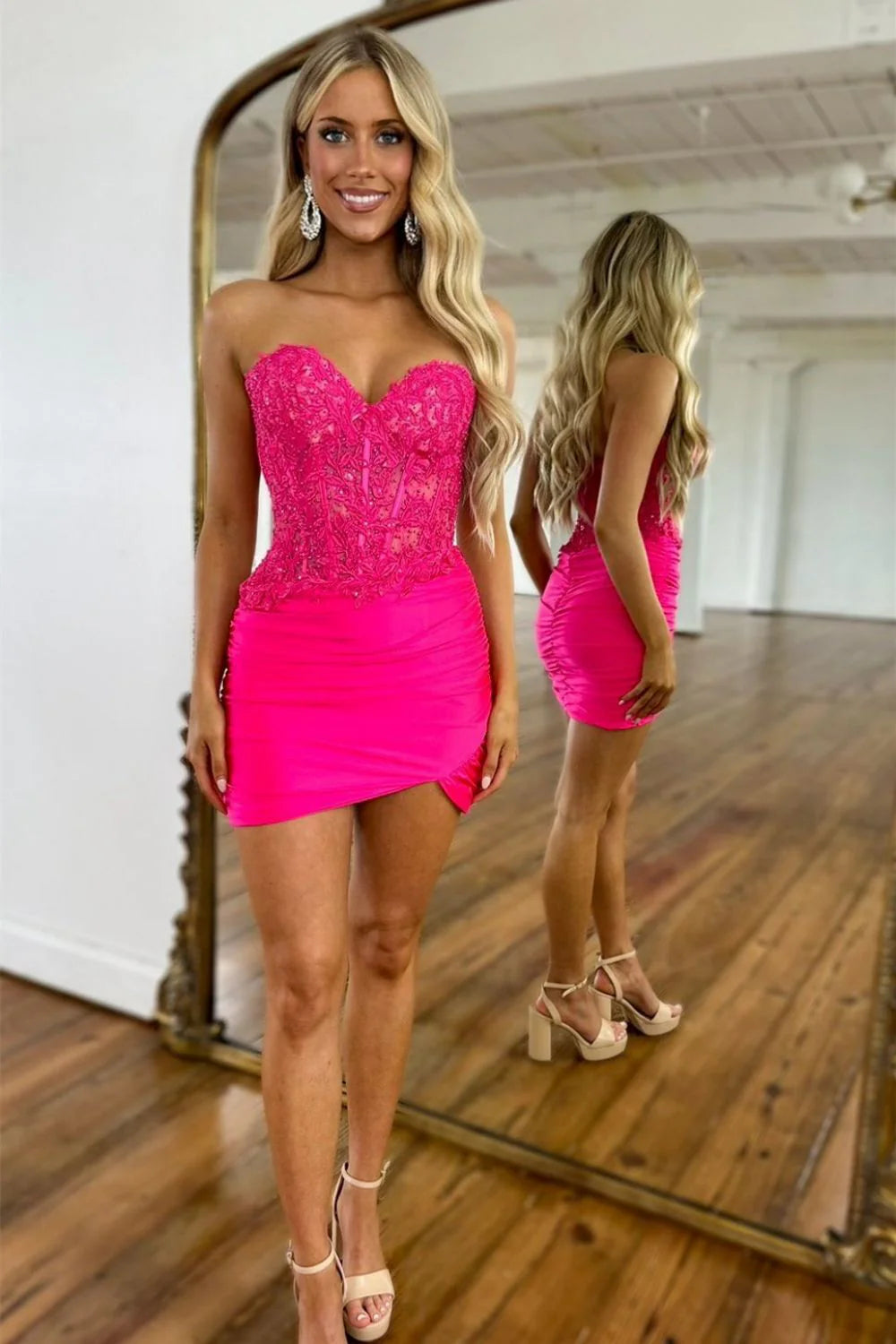 Hot pink mermaid short homecoming dress with sweetheart lace top.