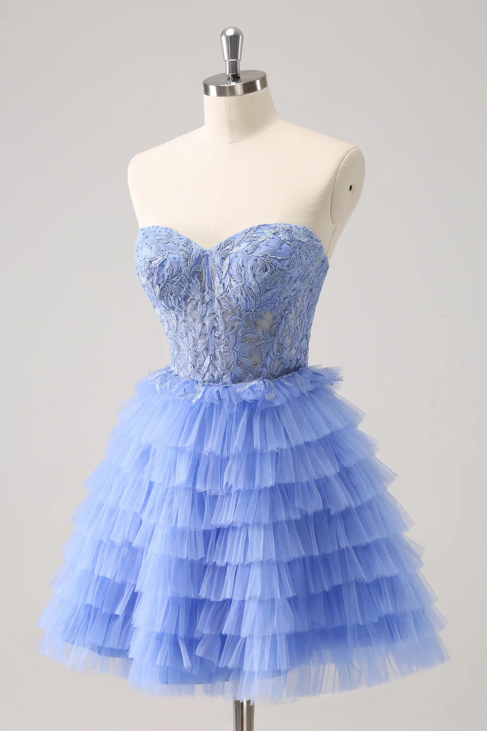 Full view of a lilac A-line tiered gown, showcasing the flowing skirt and elegant silhouette.