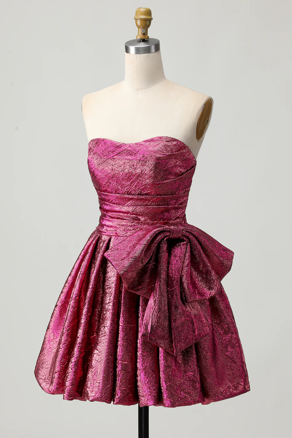 Back view of the metallic dark purple ruched strapless homecoming dress, showing the elegant silhouette.