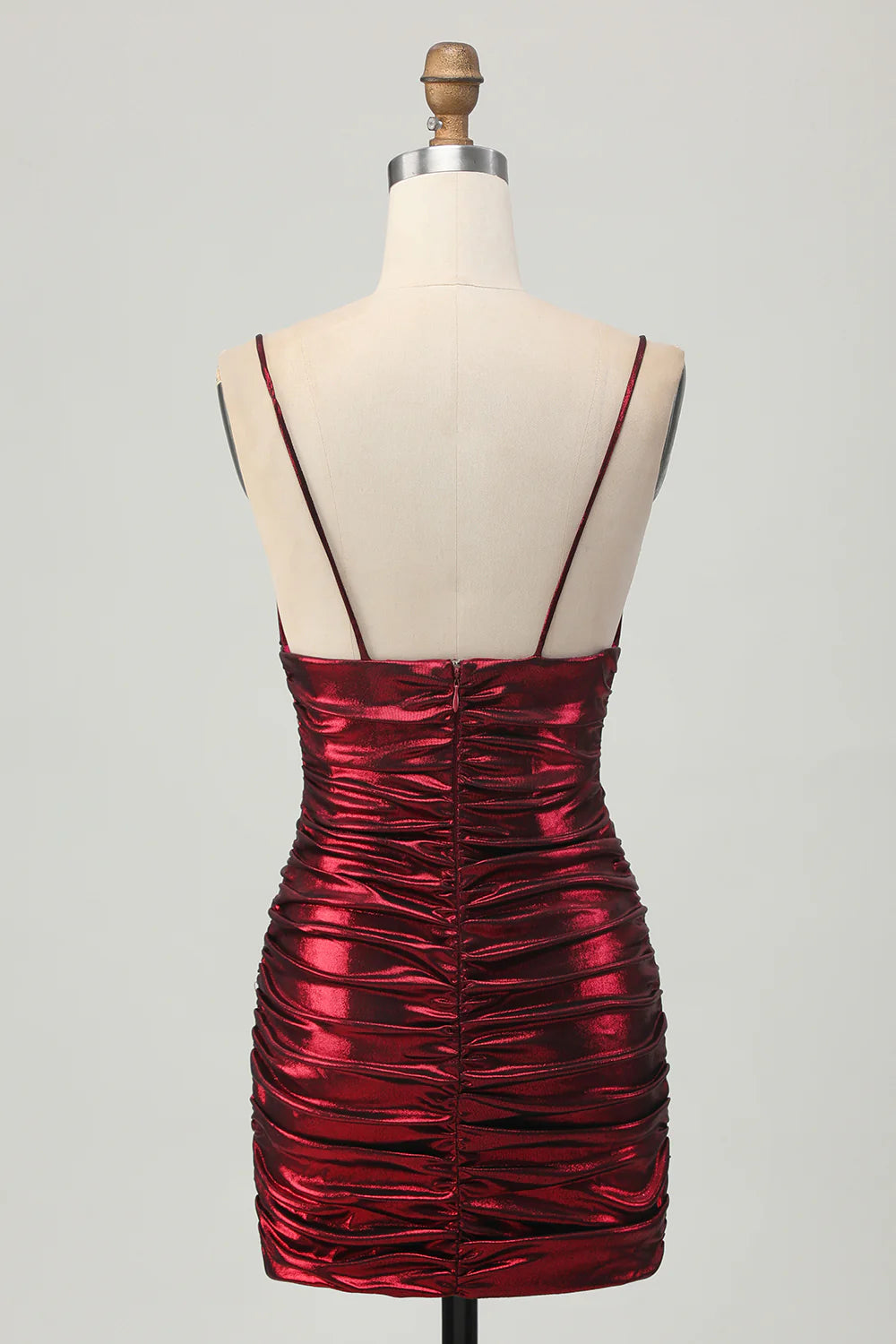 Back view of the metallic burgundy ruched satin short dress, highlighting the spaghetti straps.