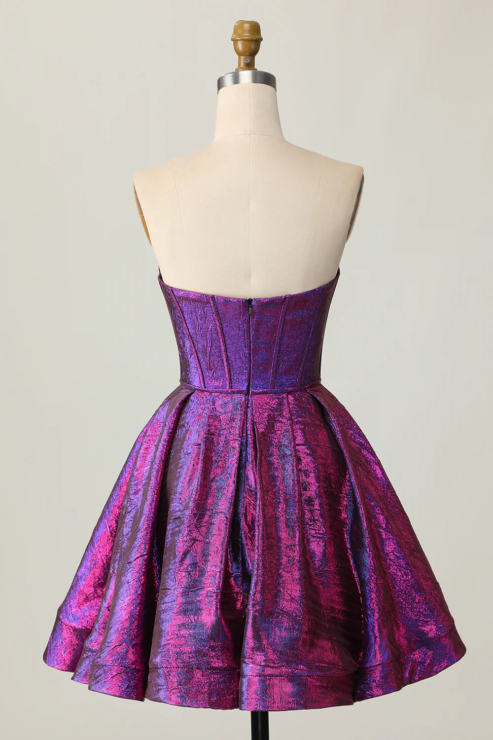 Back view of a dark purple metallic strapless A-line dress, highlighting the elegant bow detail.