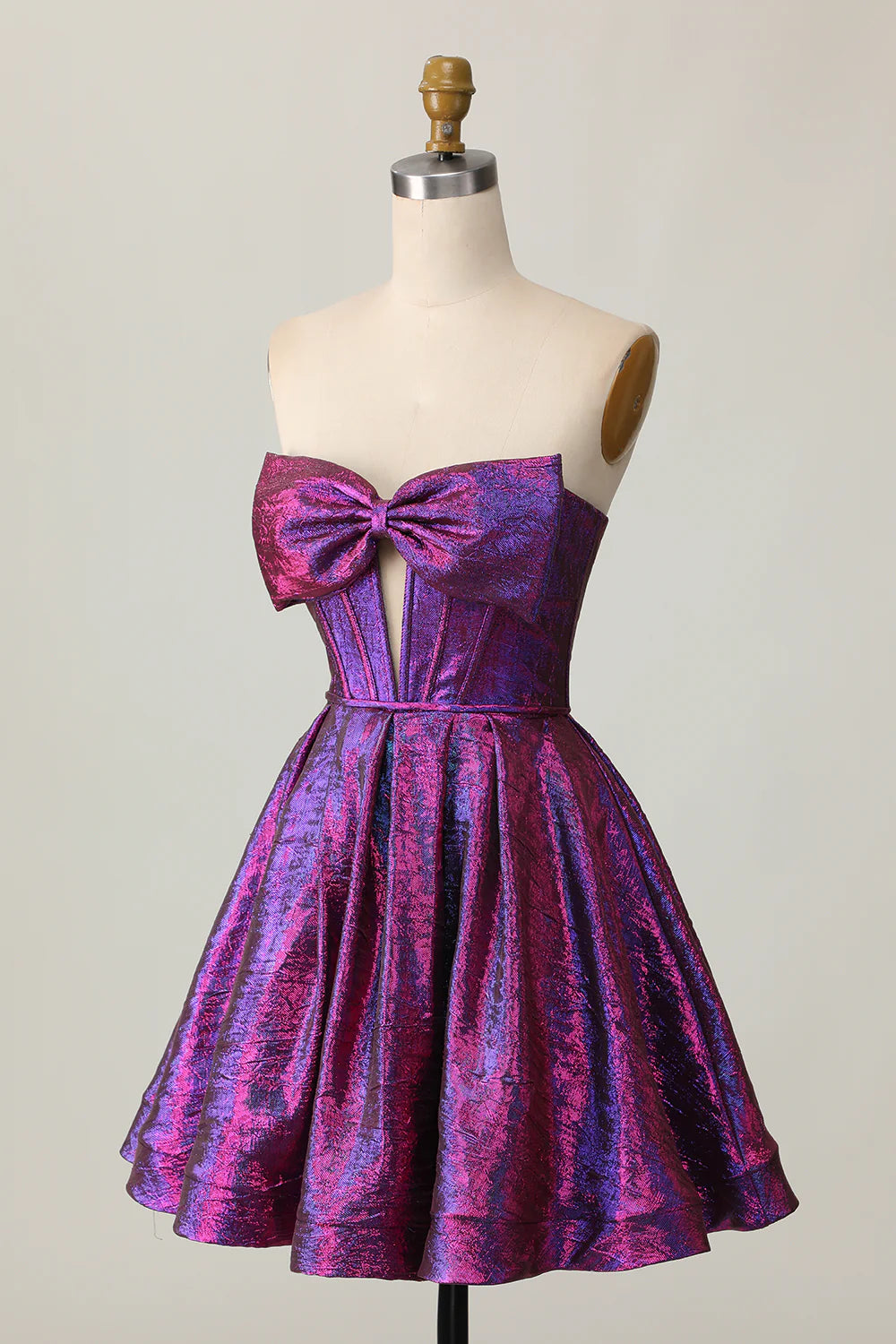 Side view of a dark purple metallic strapless A-line dress, showcasing the shimmering fabric and flowing skirt.