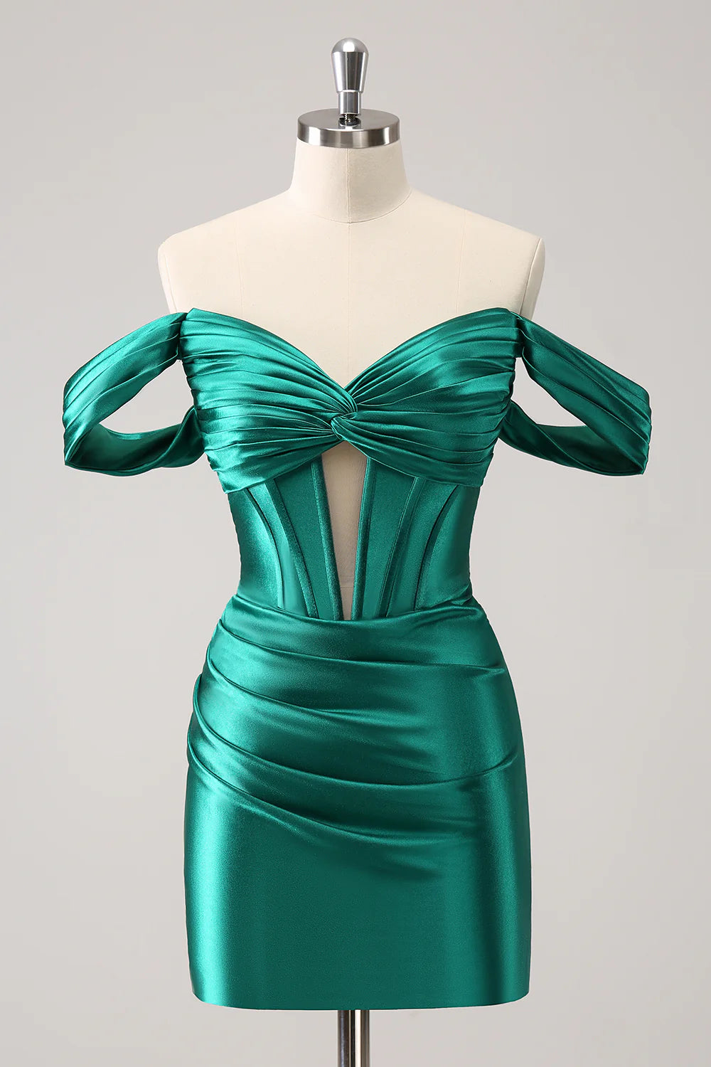 Model wearing a dark green off-shoulder ruched corset homecoming dress.