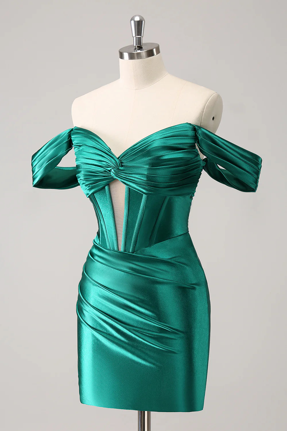 Close-up of the ruched corset and off-shoulder neckline on the dark green satin dress.