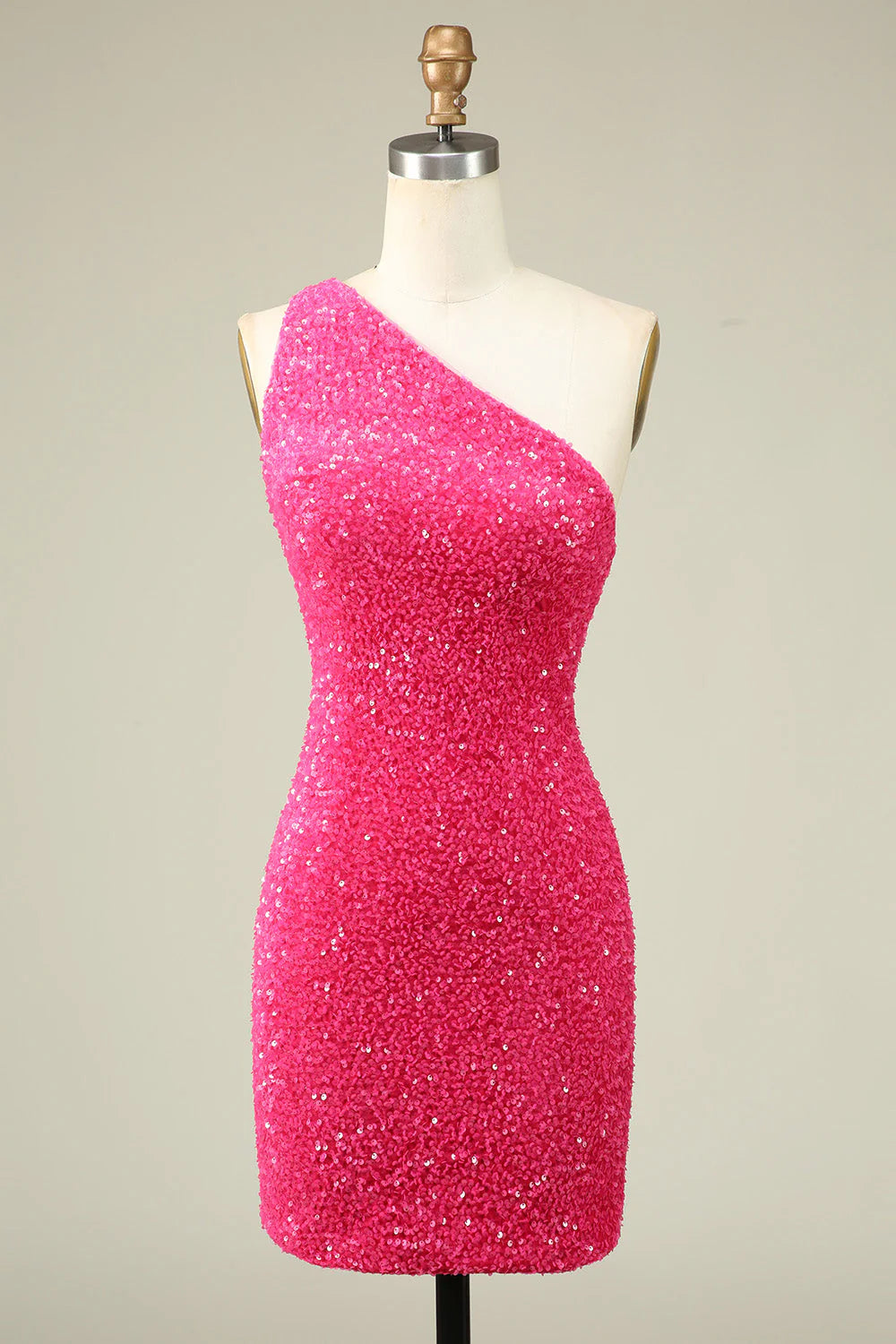 Fuchsia one-shoulder sequin homecoming dress with a tight fit.