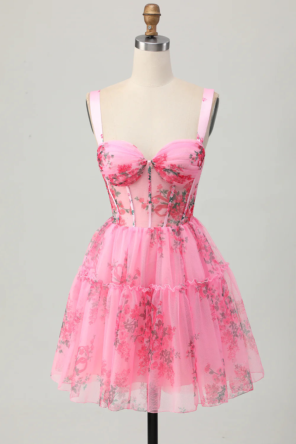 Model wearing a pink floral printed strapless A-line short homecoming dress.