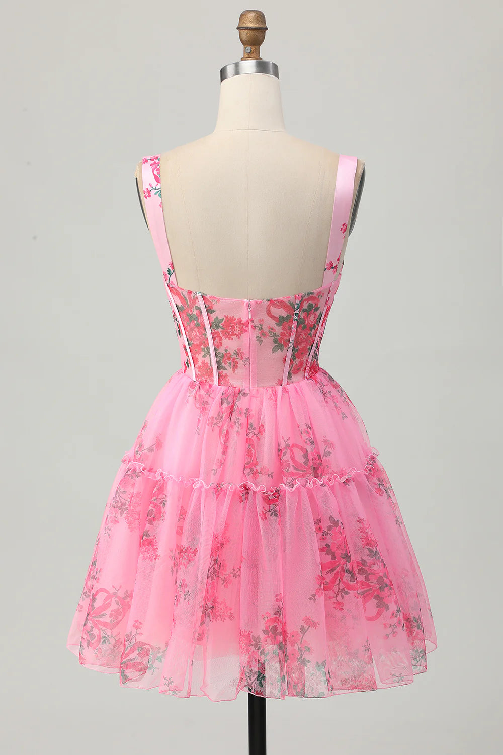 Side view of the pink floral printed corset homecoming dress.