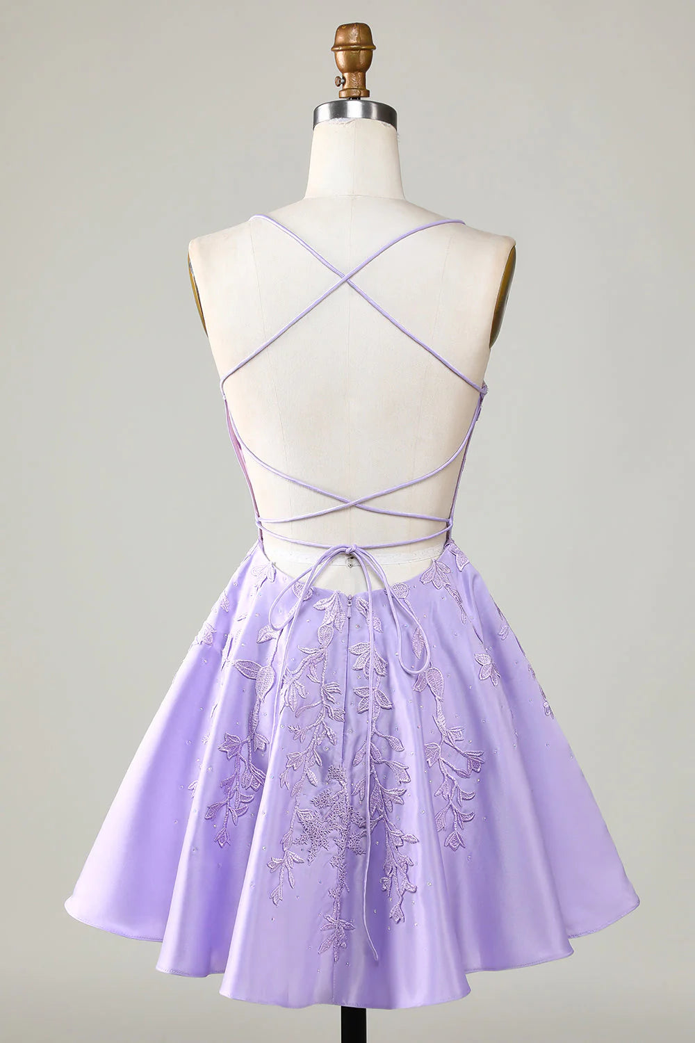 Side view of a purple corset A-line short homecoming dress.