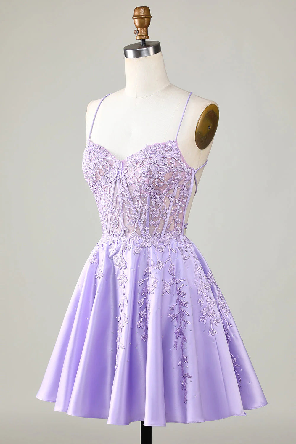 Back view of a purple corset A-line short homecoming dress with lace details.