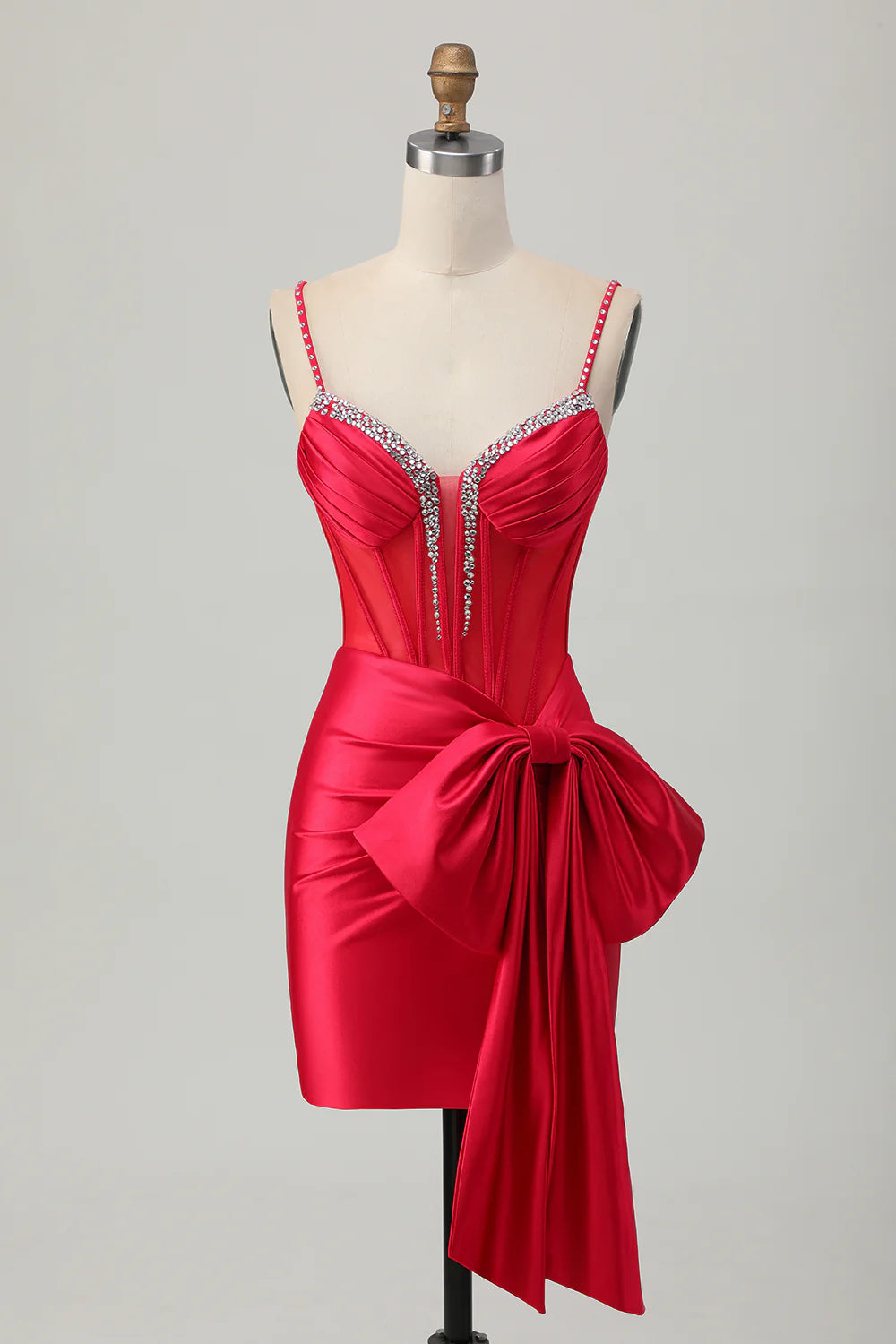 Red bodycon homecoming dress with beaded corset and front bow detail.