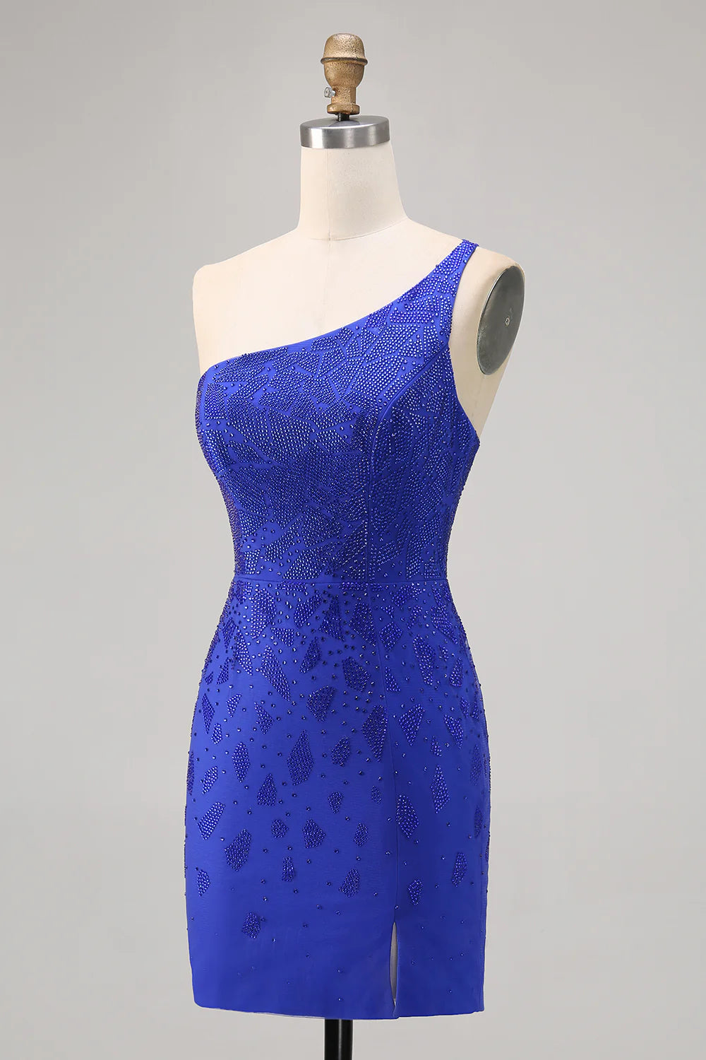 Model wearing a royal blue bodycon one-shoulder beaded homecoming dress with a high slit, back view.