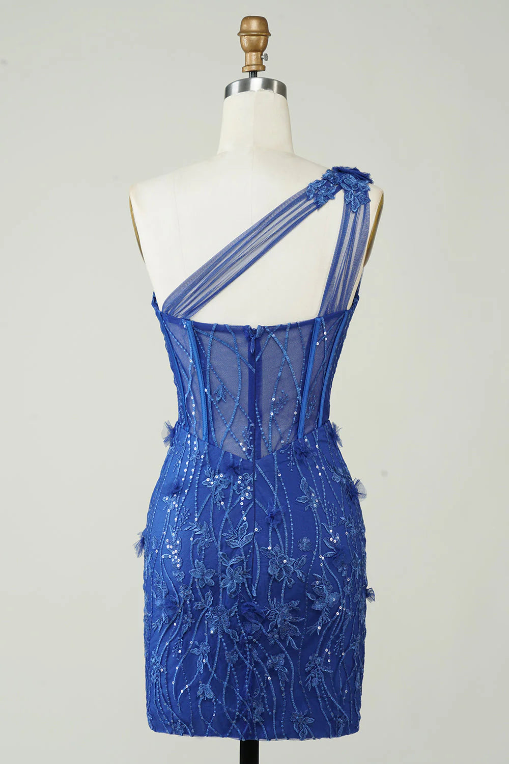Back view of royal blue one-shoulder homecoming dress with appliques.