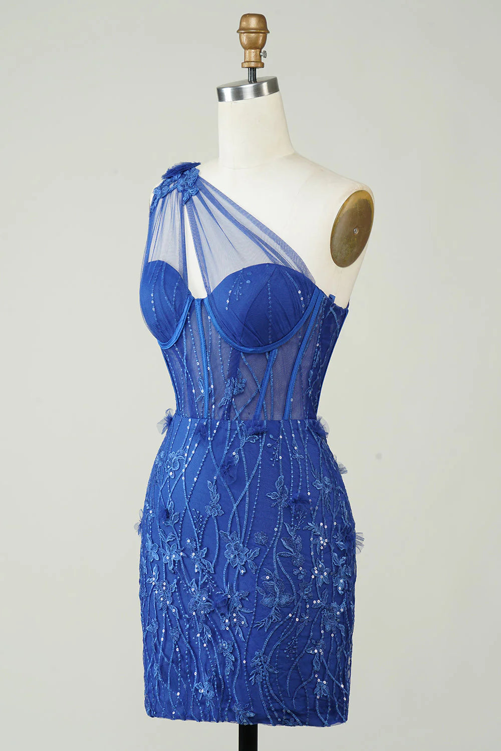 Side view of royal blue sheath homecoming dress with applique details.