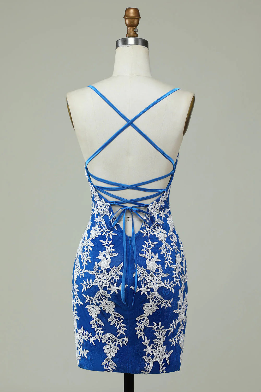 Side view of blue sheath dress, highlighting its elegant silhouette and appliques.