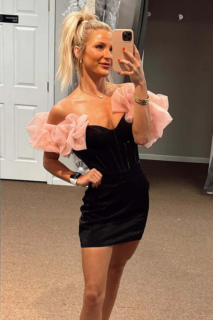 Elegant black mini homecoming dress with a sweetheart neckline.