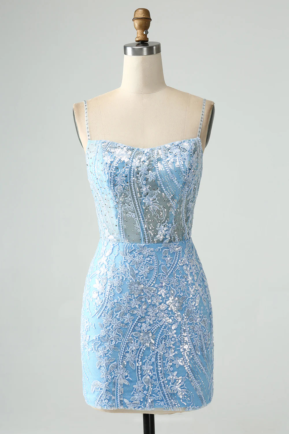 Sparkly sky blue short homecoming dress with spaghetti straps and beading.