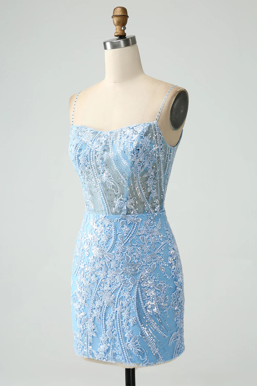 Close-up of the intricate beading on the sparkly sky blue dress.