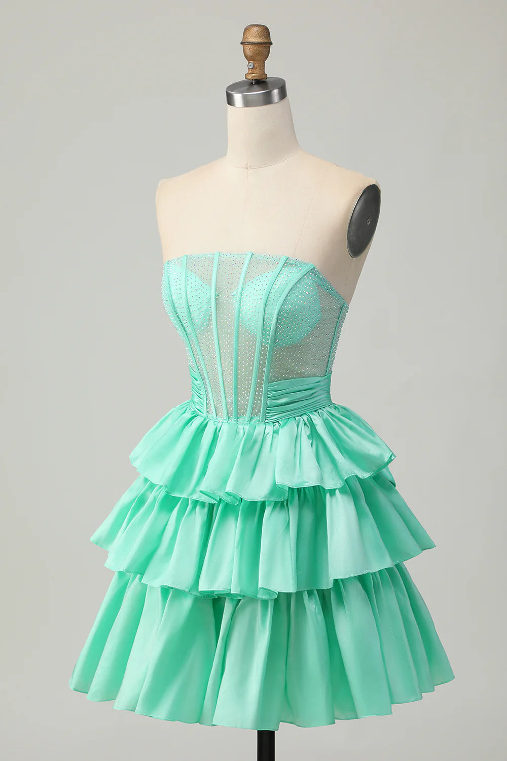 Close-up of beaded corset bodice on strapless homecoming dress.