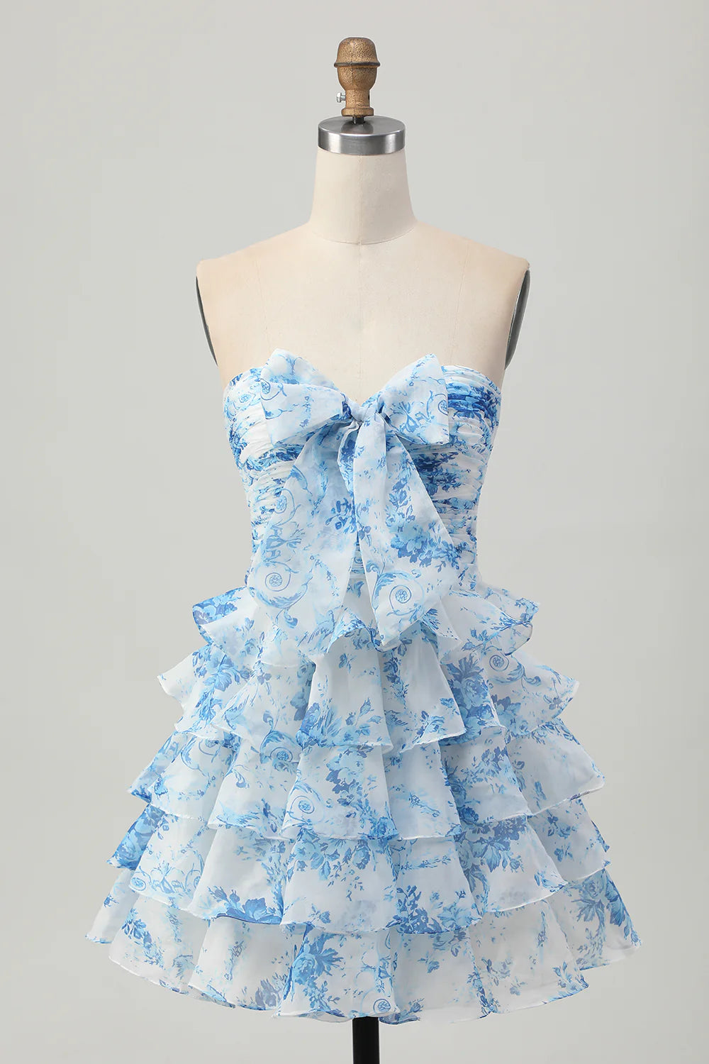 White and blue floral strapless A-line tiered short homecoming dress with a bow.