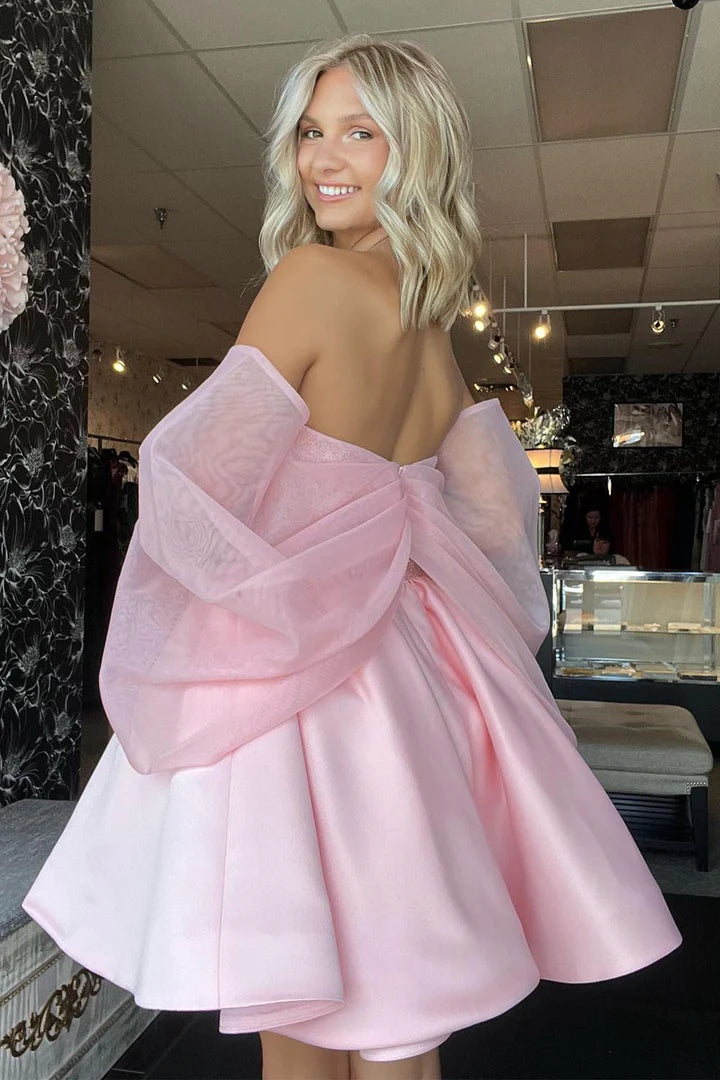 Full view of the light pink floor-length gown, ideal for homecoming.
