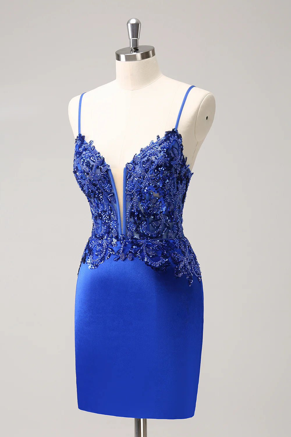 Close-up of beading and ruching on the royal blue dress.