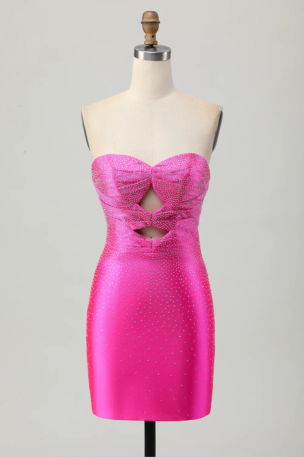 Fuchsia strapless satin homecoming dress with beading and cut-out details.