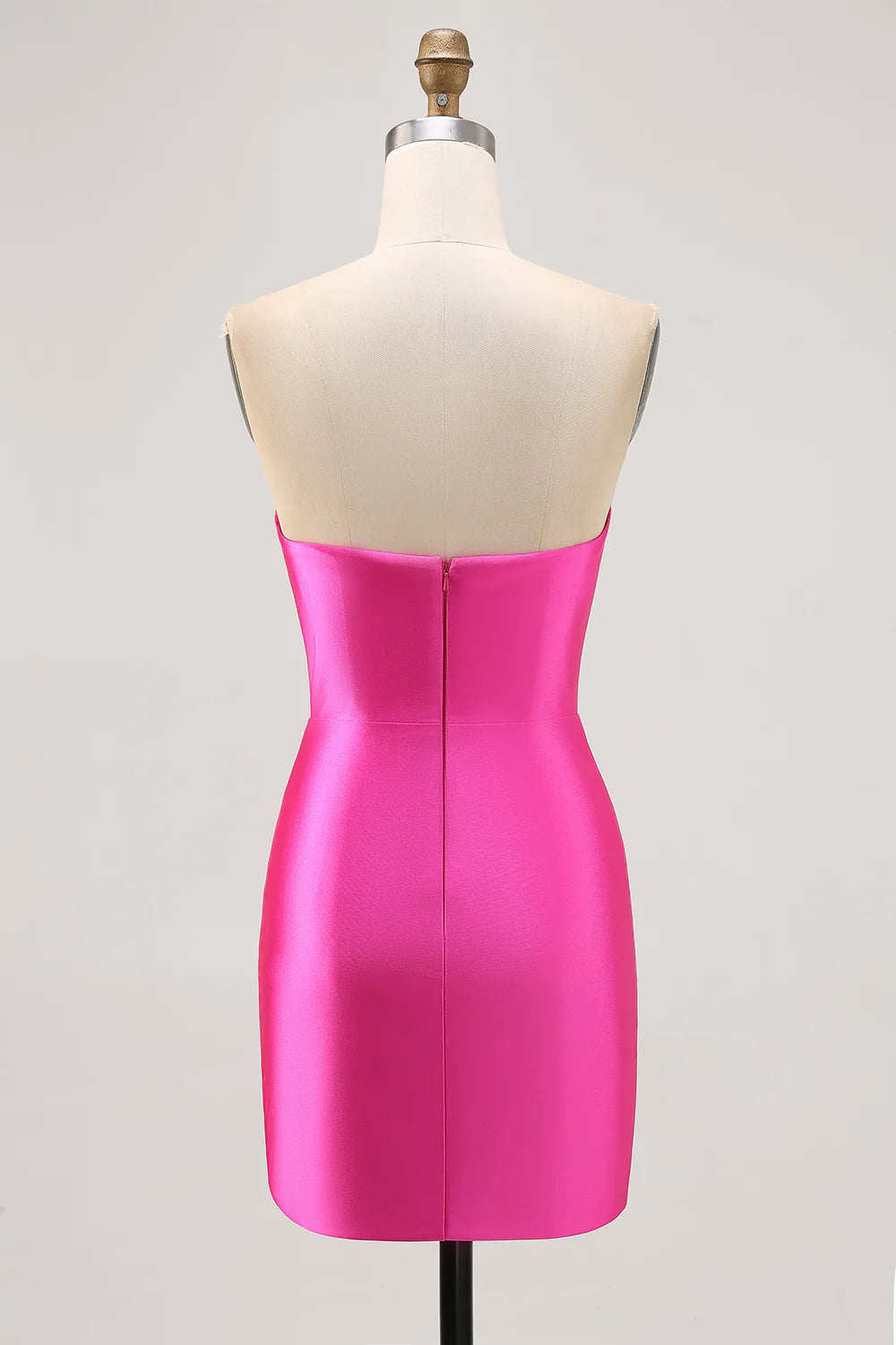 Back view of the fuchsia strapless tight satin dress with rhinestone embellishments.
