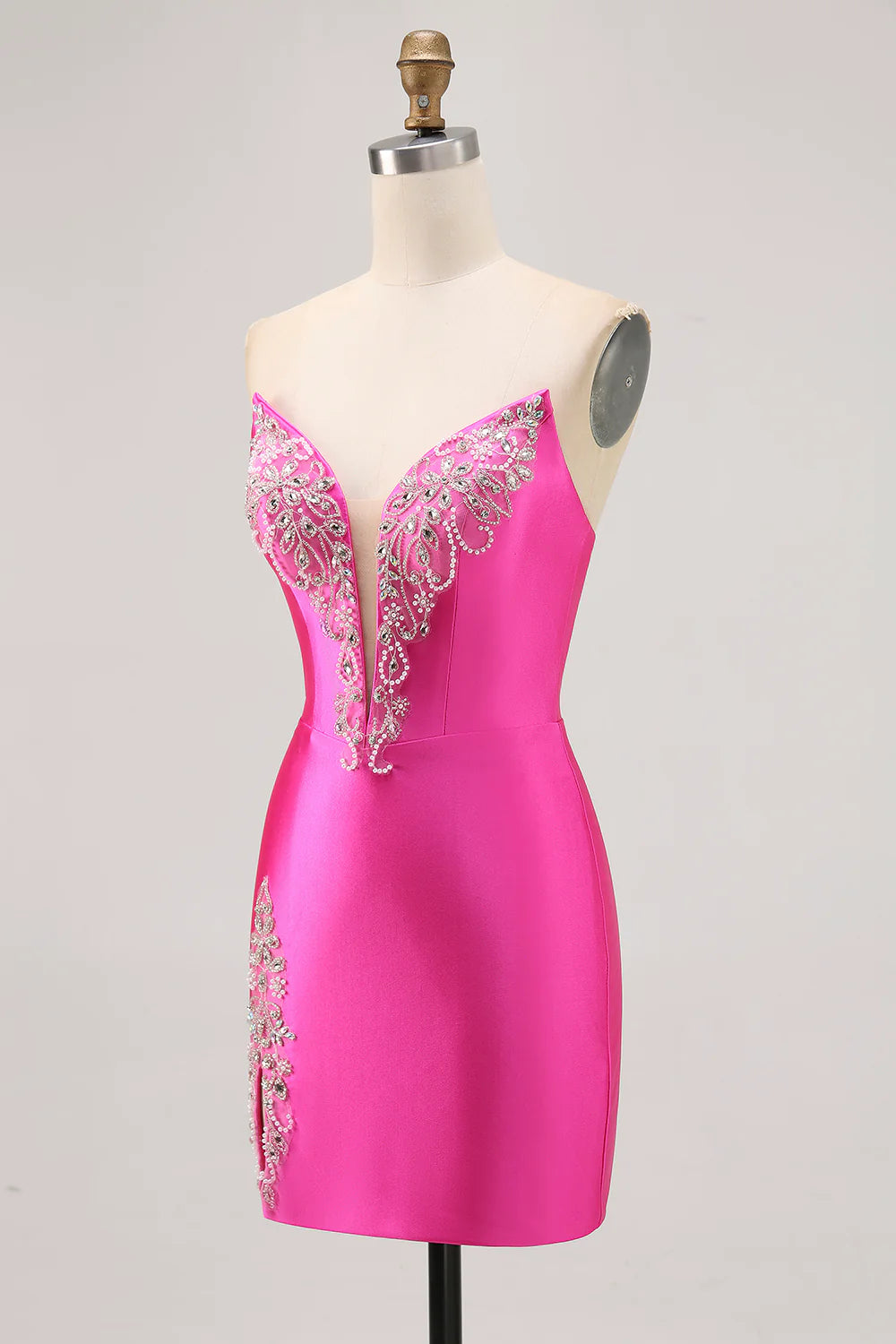 Side view of the elegant fuchsia short homecoming dress in satin with beading.
