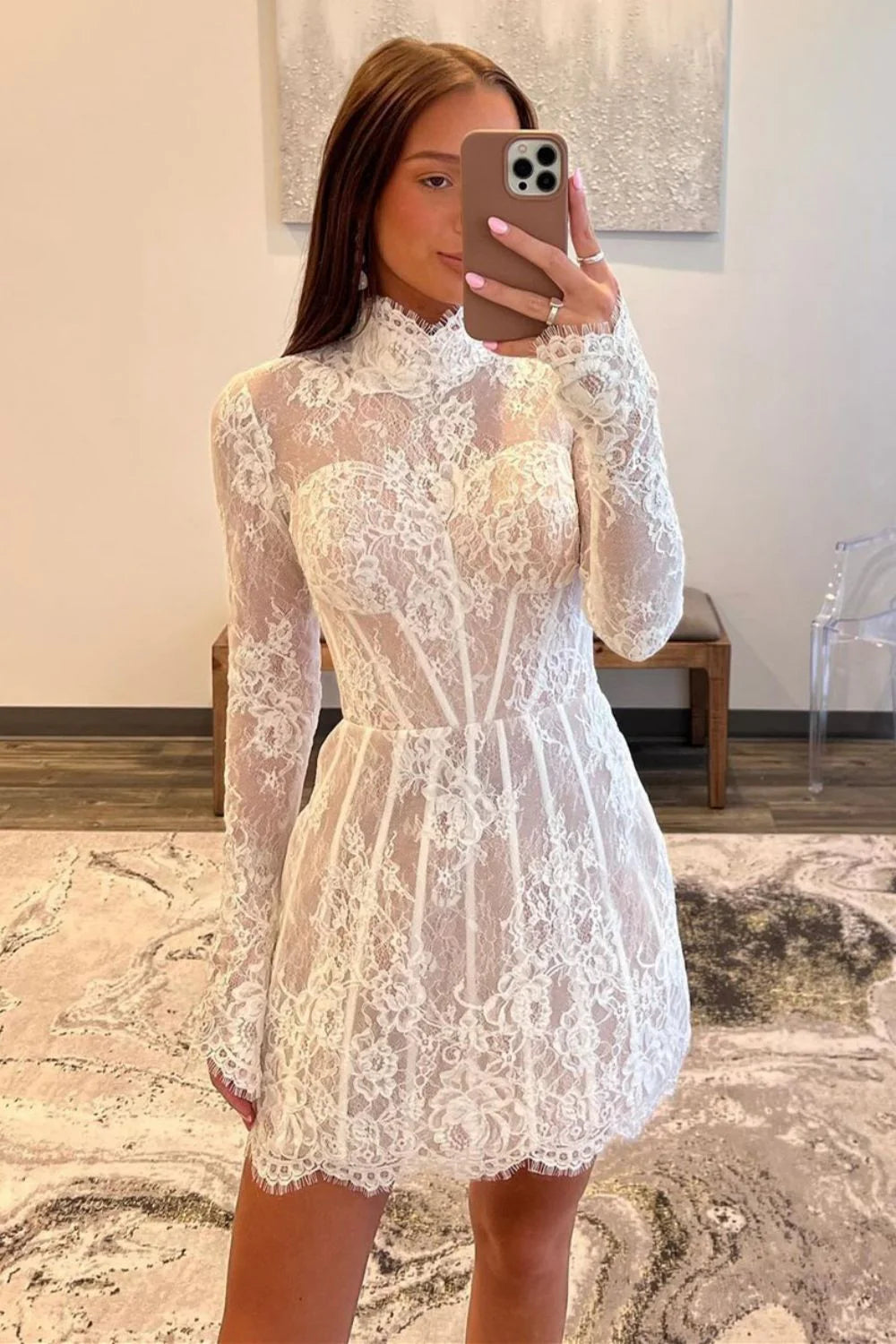 White A-line homecoming dress with high neck and long lace sleeves.