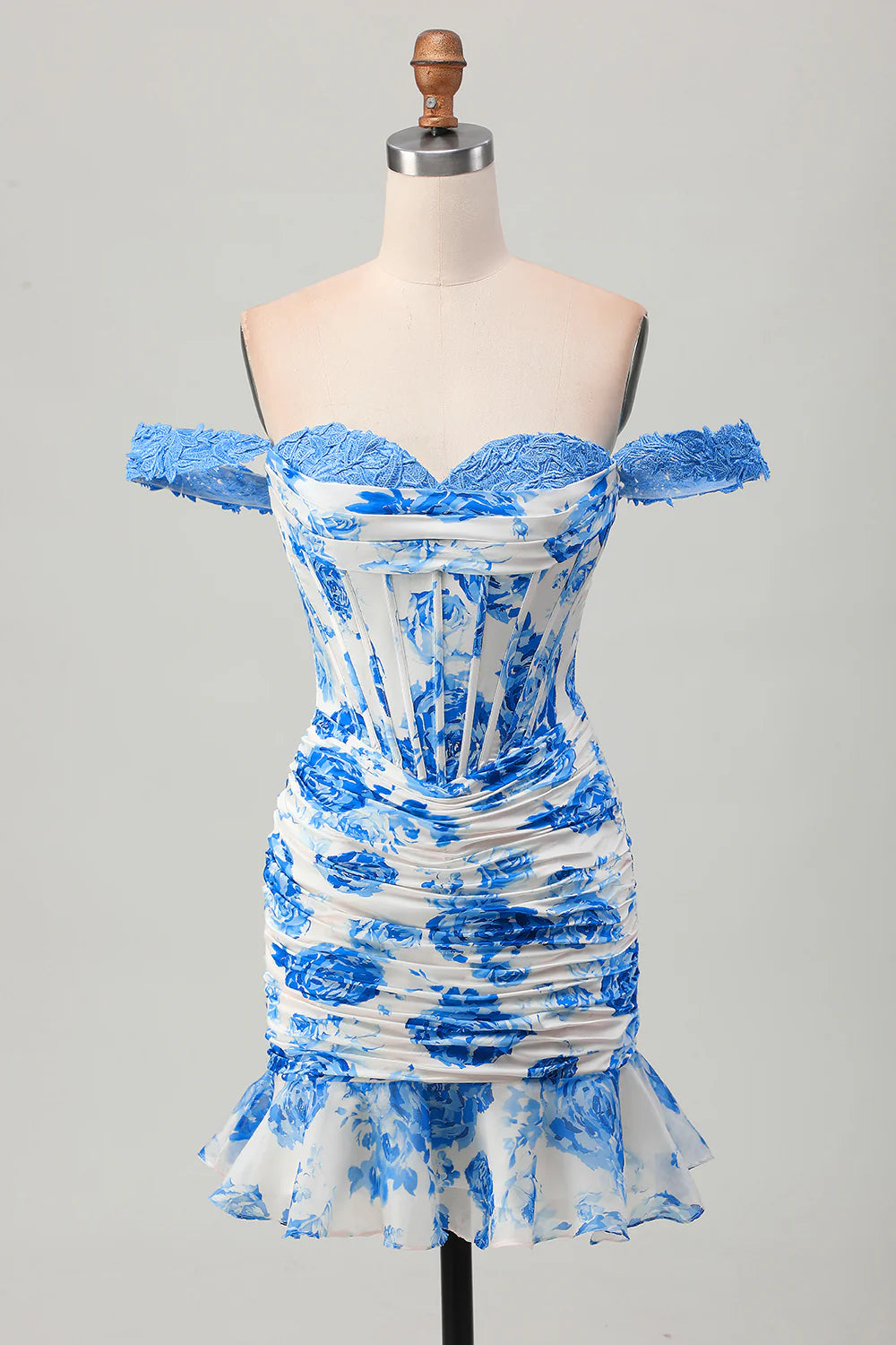 Model wearing a white and blue floral bodycon off-shoulder corset short homecoming dress.